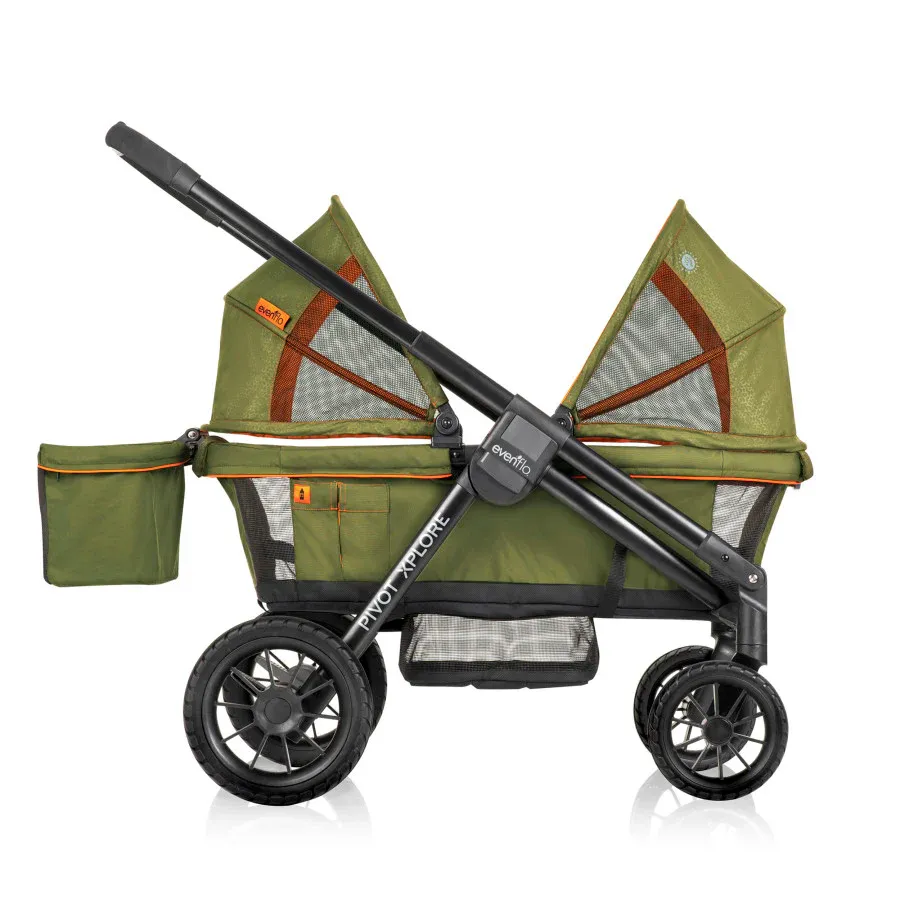 Green and black twin baby stroller with large wheels and storage compartments.