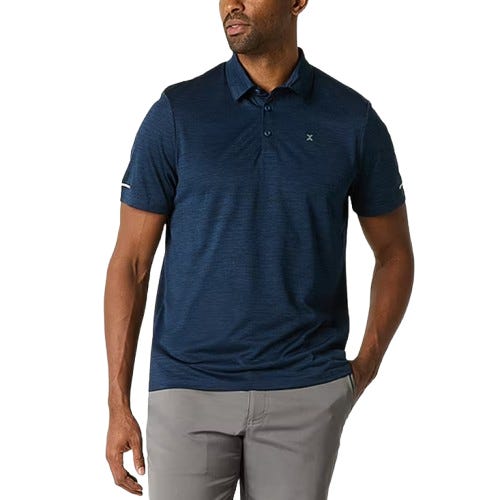 A man is wearing a navy blue short-sleeve polo shirt paired with gray pants.
