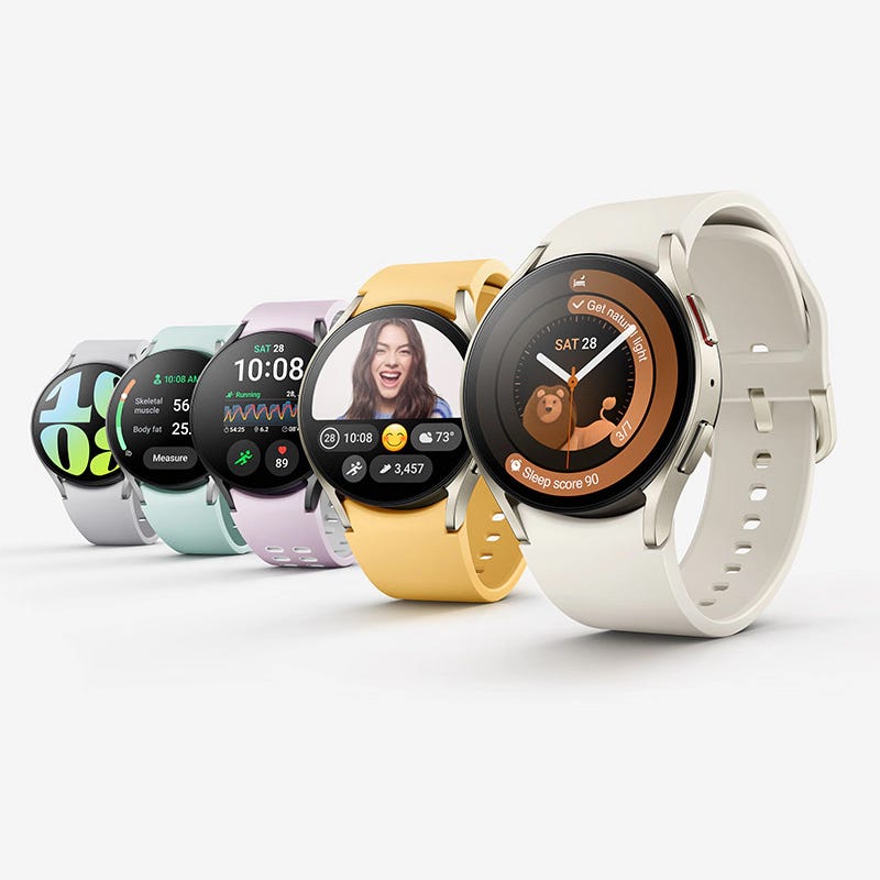 A collection of smartwatches in various colors with different screen displays showing health stats, a photo, and a navigational prompt.