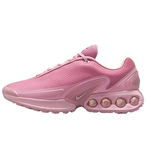 Pink athletic shoe featuring a cushioned sole with visible air pockets, a mesh upper, and a small Nike logo.