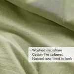 Washed microfiber comforter with a natural and lived-in look, offering cotton-like softness.