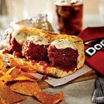 Doritos chips are displayed next to a meatball sandwich, suggesting a pairing for a meal.