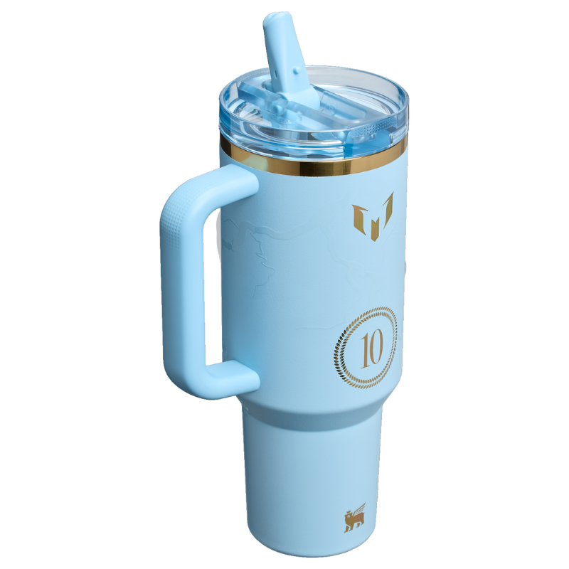 Light blue tumbler with a handle, featuring gold accents, a lid with a straw, a \“10\“ emblem, and decorative symbols.