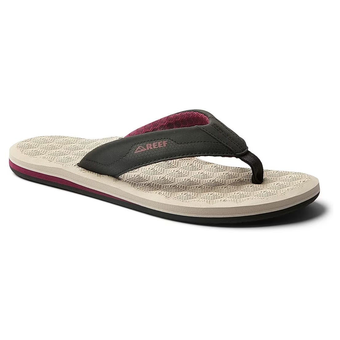 A black thong-style sandal with a textured beige sole, maroon accents, and \“REEF\“ branding on the strap.