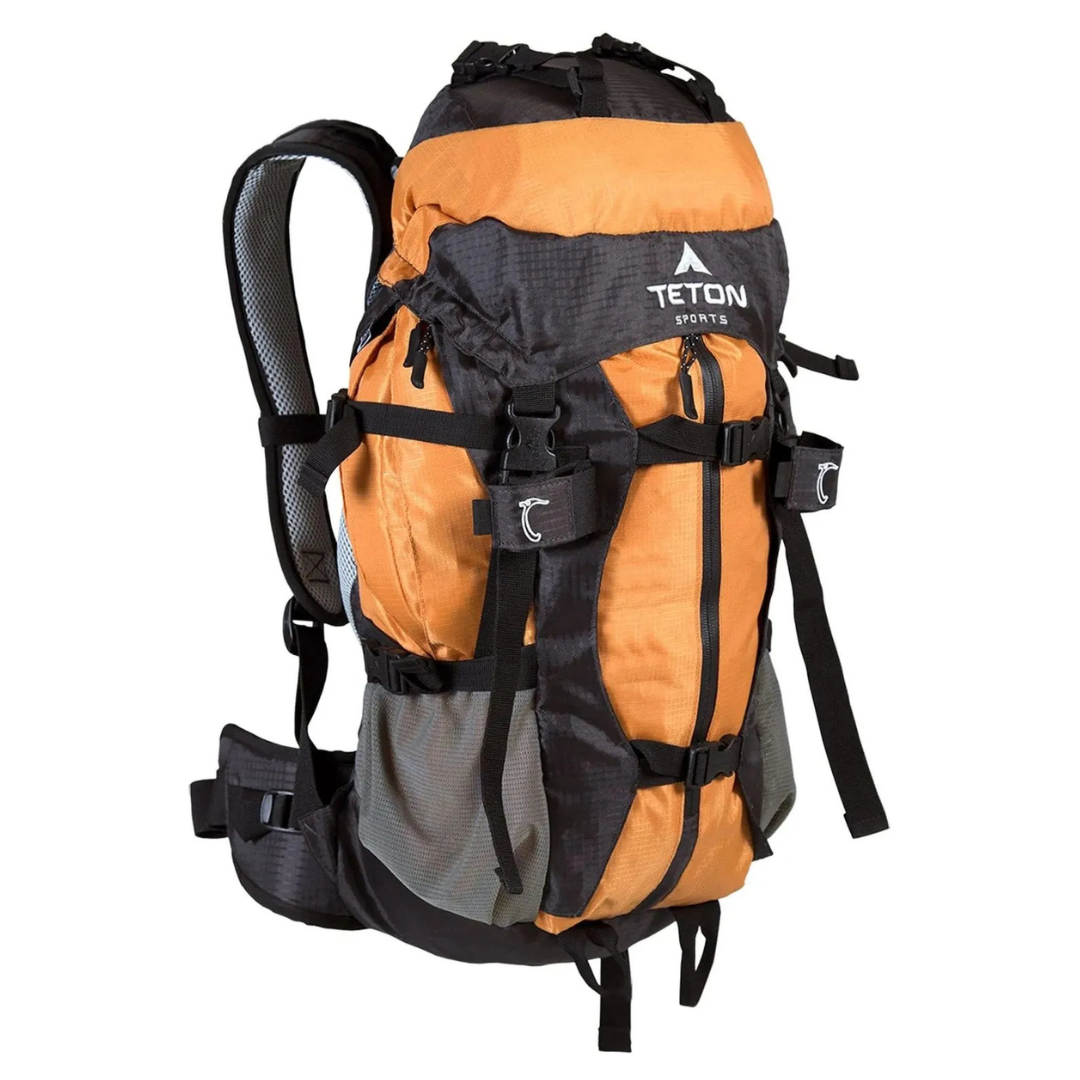 Orange and black hiking backpack with multiple straps, pockets, and a padded hip belt for support.