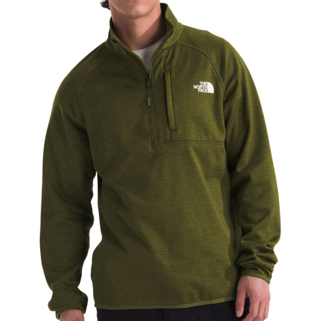 The North Face Canyonlands Fleece Jacket is an olive green, long-sleeve pullover with a half-zip design and a chest pocket, featuring the brand's logo on the upper left side.