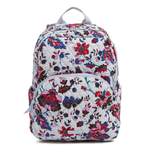 Floral patterned, quilted fabric backpack with external front zip pocket and gray top handle.