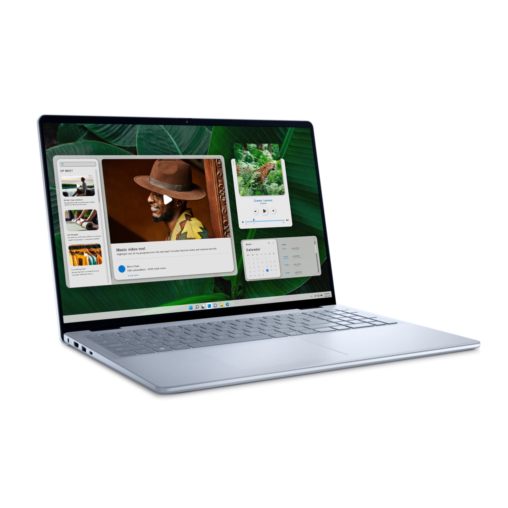 A Dell 16\“ Inspiron laptop with a silver finish, featuring a large screen with slim bezels displaying multiple open applications.