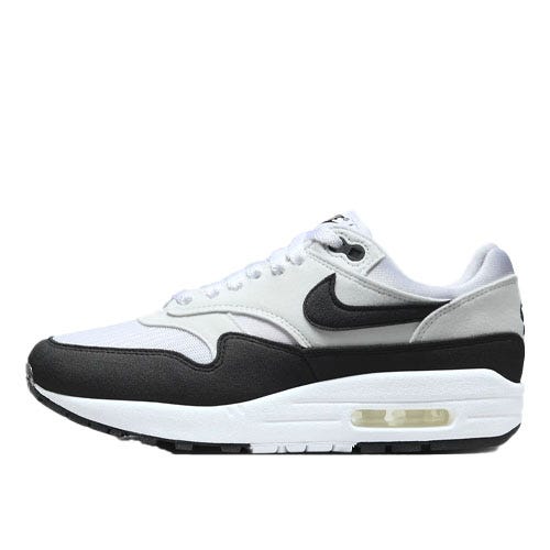 Nike Men's Air Max 1 Shoes feature a classic design with a white and black color scheme, visible air cushioning in the sole, and a sleek silhouette with a black Swoosh logo on the side.