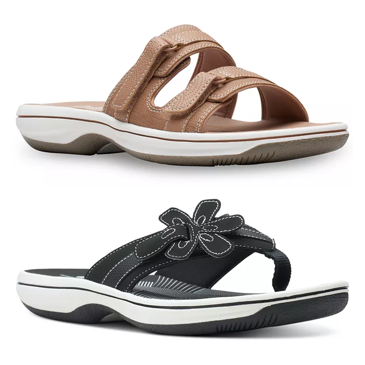 Two pairs of women's sandals: top is tan with straps, bottom is black with a floral embellishment.