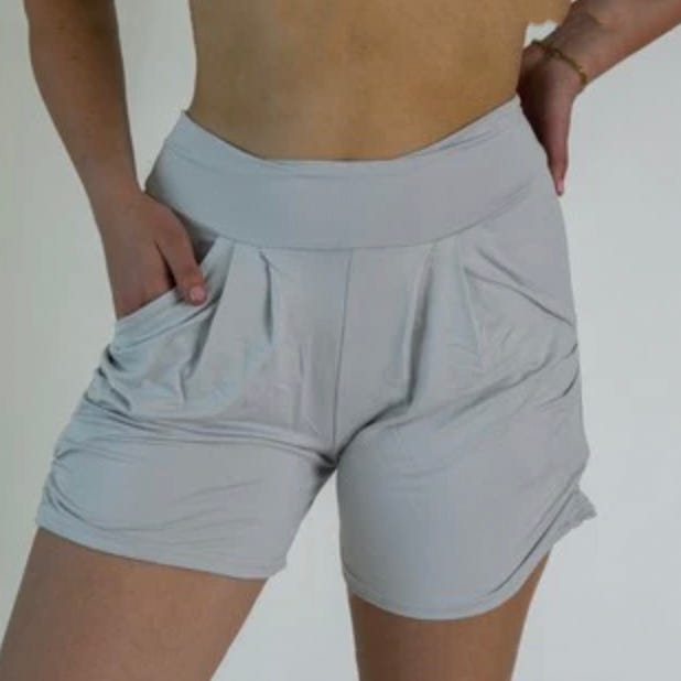 Light gray gym shorts with a high waistband and front pockets worn by a person.