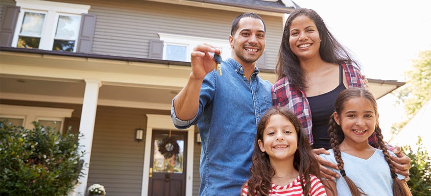 family with keys to new home