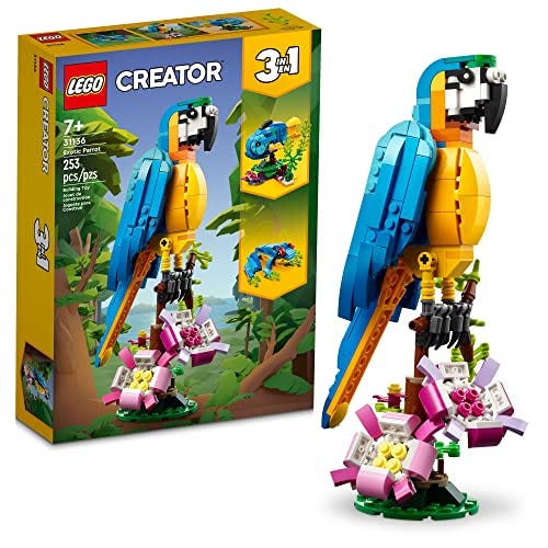 A LEGO Creator 3-in-1 set featuring a model of a colorful parrot perched on a branch, with box art showing alternative builds including a chameleon and a fish.