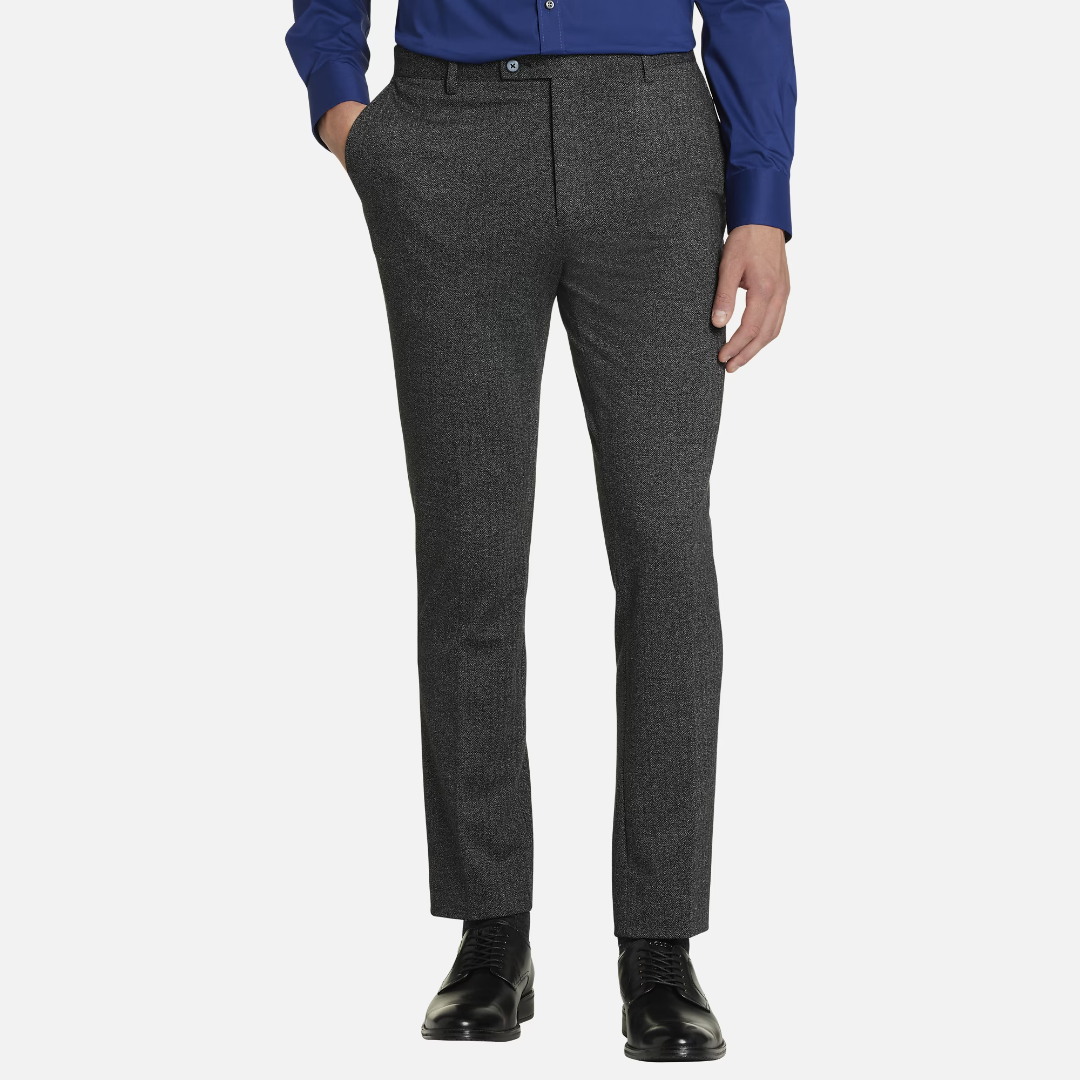 Pair of textured grey dress pants matched with black shoes.