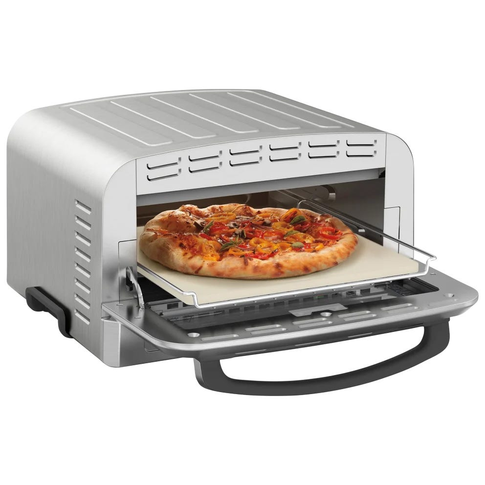 A countertop pizza oven with a pizza inside, featuring brushed stainless steel housing and a pull-down door. The oven includes a baking stone and is designed for home use.