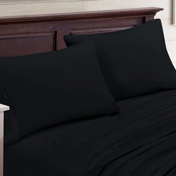 A set of black sheets and pillowcases on a bed.