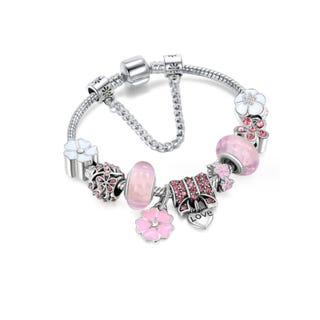 Charm bracelet with various beads and pendants, including flowers and hearts, in silver tone with pink and red accents.