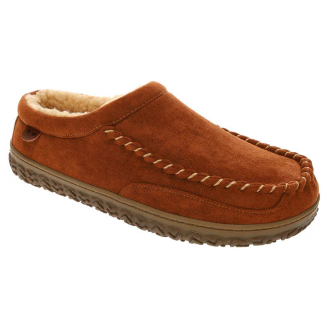 Dockers Clog Slippers feature a brown suede exterior with a braided trim and a soft fleece lining for comfort. They have a durable, textured rubber sole for indoor and outdoor use.