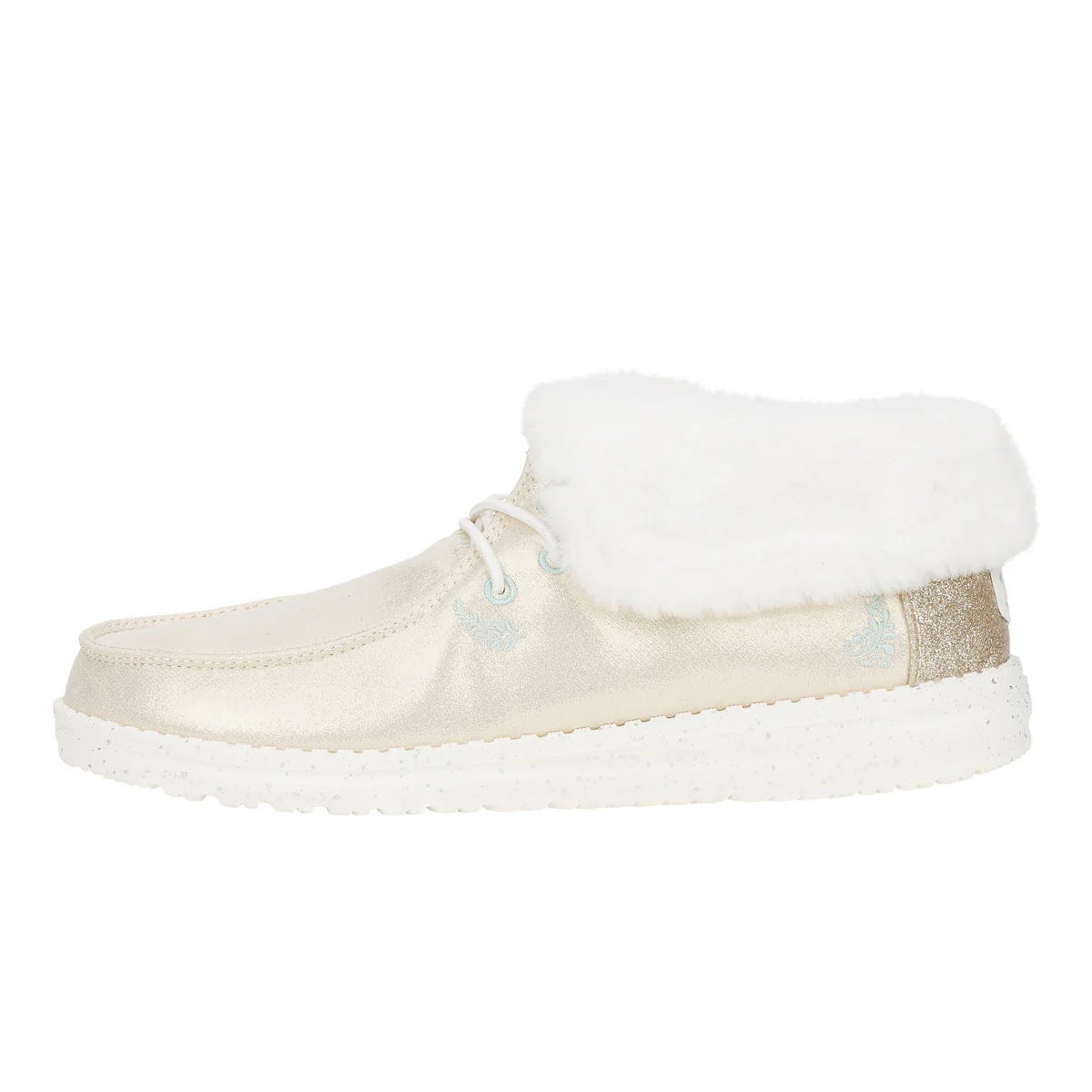 Cream-colored booties with a metallic sheen, featuring a fluffy white fold-over cuff and speckled white sole, accented with small blue embroidery near the laces.