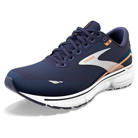 A single navy blue running shoe with white soles and orange detailing.