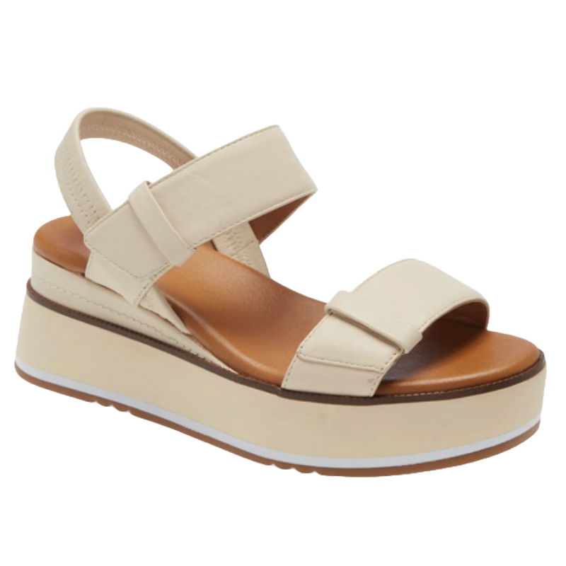 A beige platform sandal with two wide straps and an adjustable back strap, featuring a brown sole and white accent.