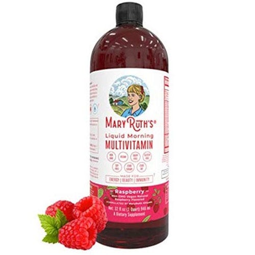 Mary Ruth's Liquid Morning Multivitamin in Raspberry flavor, designed for energy, beauty, and immunity support, is shown in a 32 fl oz bottle alongside fresh raspberries.