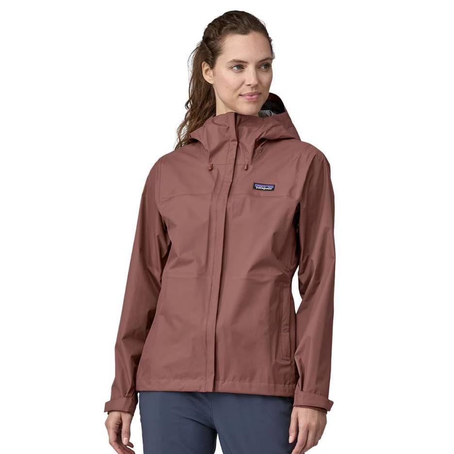 Patagonia Torrentshell Jacket is a waterproof, breathable rain jacket with a hood, made from durable recycled materials. It features a simple, minimalist design with a front zipper and side pockets.