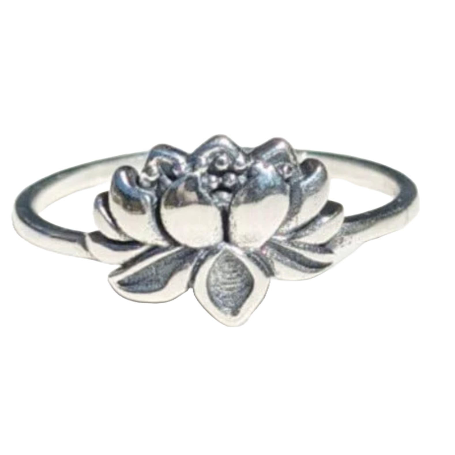 A silver ring featuring a lotus flower design with detailed petal engravings.