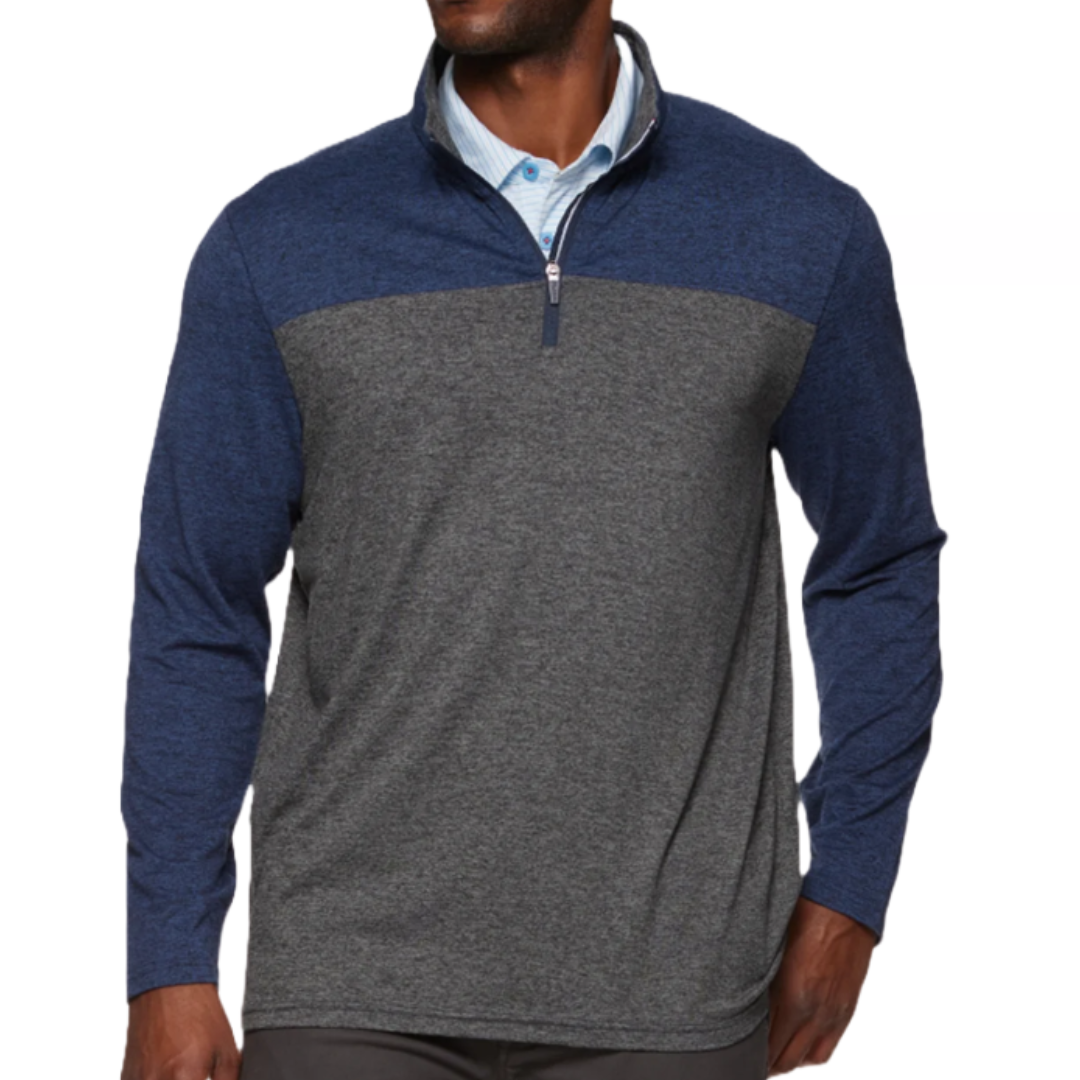 A men's pullover featuring a two-tone design with a navy upper and gray lower section, complemented by long sleeves and a quarter-zip collar.