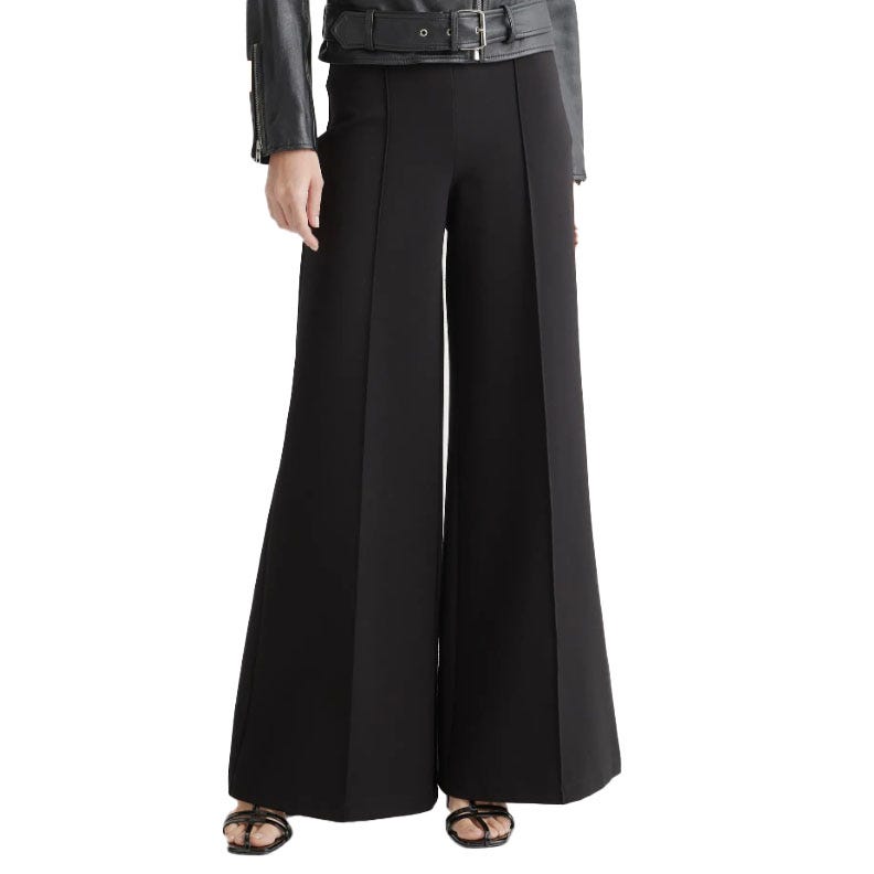 Black stretch ponte palazzo pants featuring wide legs and front pleats, paired with a leather jacket and open-toe heeled sandals.