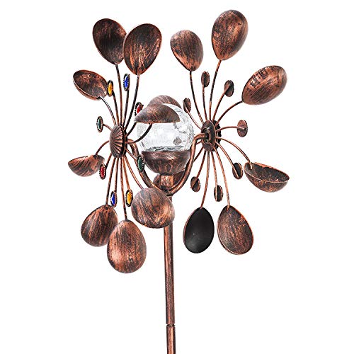 A bronze-colored metal wind spinner with solar LED lighting, featuring a spherical center with two layers of petal-like blades, and a decorative leafy stem at the base.