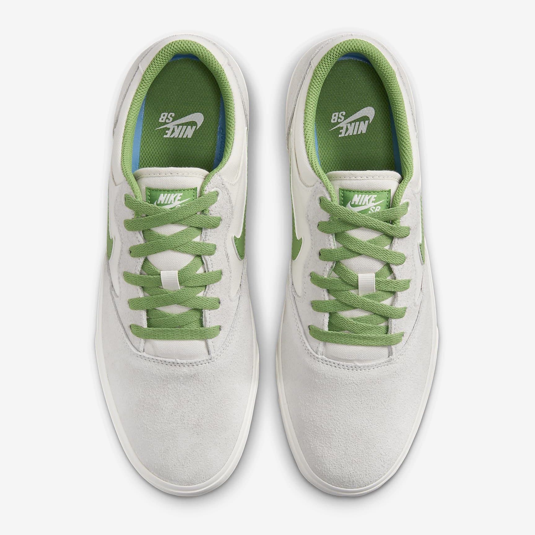 A pair of white sneakers with green laces and green Nike logo accents.