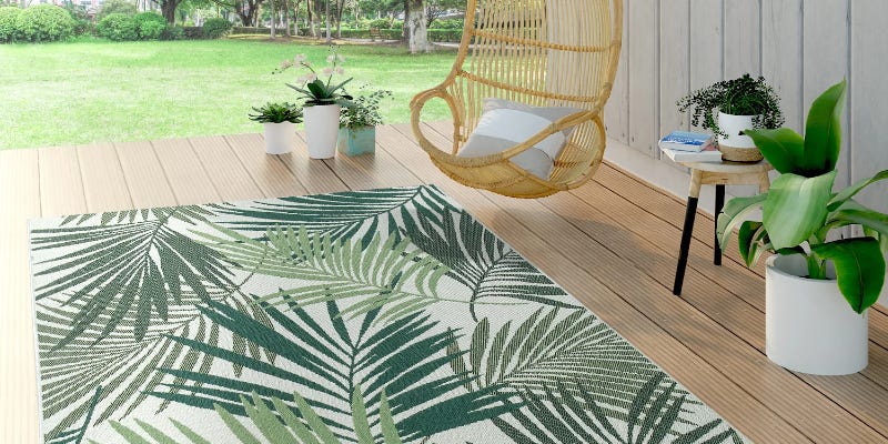 patio with rug and hanging chair