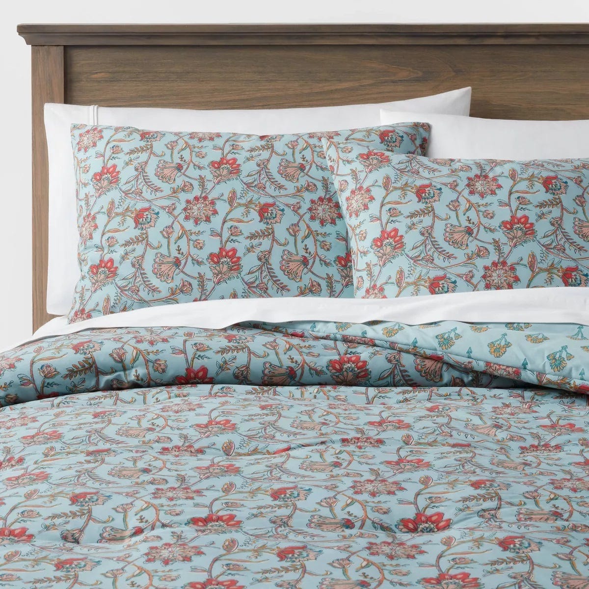 A bedding set with floral pattern, including a duvet cover and pillowcases.