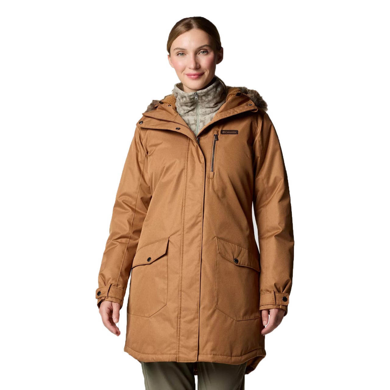 A woman is wearing a brown Columbia winter coat with a hood, featuring multiple pockets and a high collar.