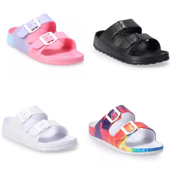 Four pairs of sandals with double buckle straps; one pastel ombre, one black, one white, and one with a colorful abstract print.
