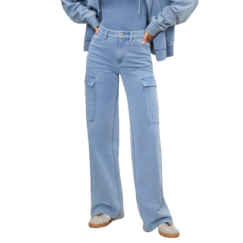 Light blue, high-waisted cargo jeans with wide legs and large side pockets. Paired with casual sneakers and a matching blue hoodie.