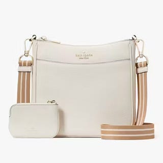 A white shoulder bag with a matching small pouch and an adjustable striped strap.
