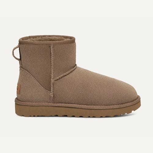 Tan short boot with a plush lining and rubber sole.