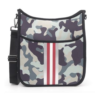 A shoulder bag with a camouflage pattern and a vertical red and white stripe.