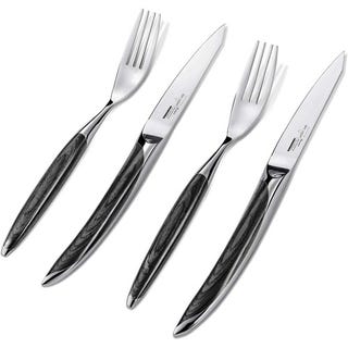 A set of two knives and two forks with metallic blades and black marbled handles.