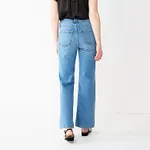 Light blue high-waisted jeans with a straight leg design and back pockets visible; paired with a black top and open-toe heels.