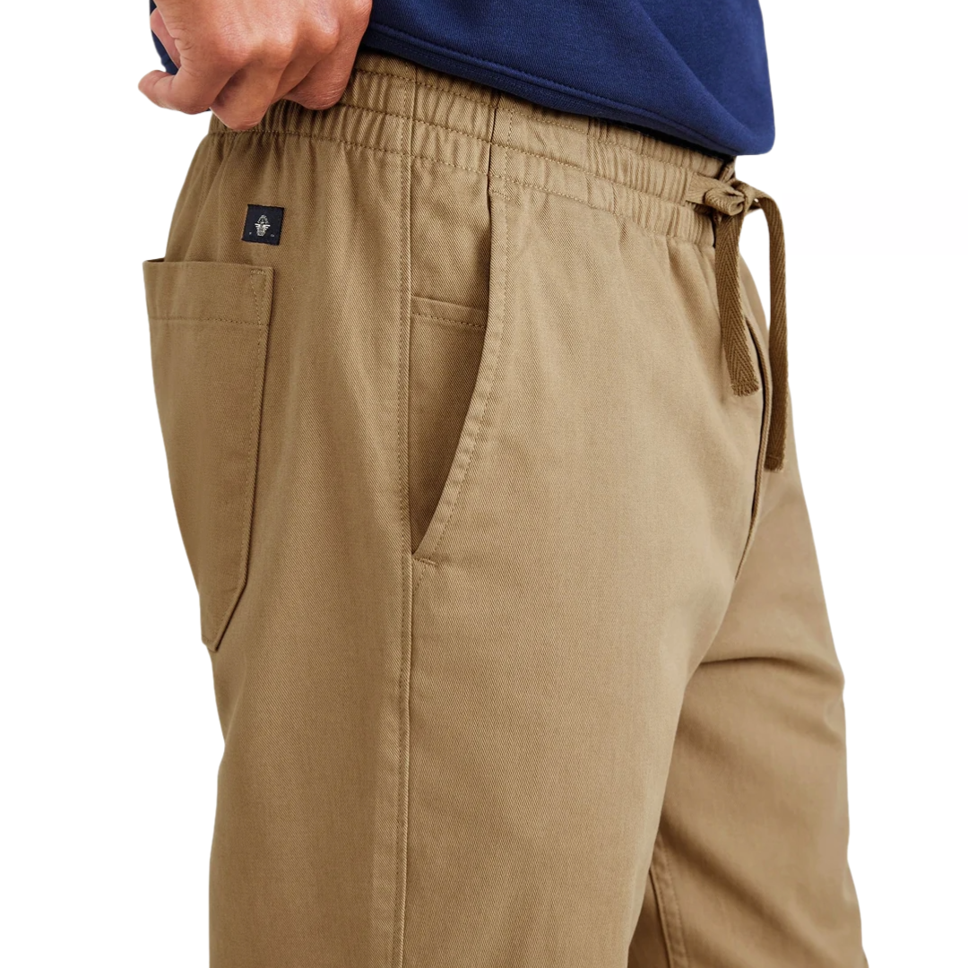 Dockers Pull-On Khakis are tan casual pants featuring an elastic waistband with a drawstring, side pockets, and durable stitching for comfort and functionality.