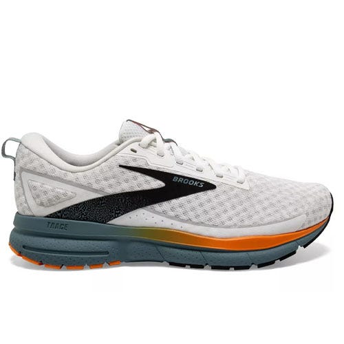 White Brooks Trace running shoe with a breathable mesh upper, black logo accents, and an orange and blue sole for cushioning and traction.