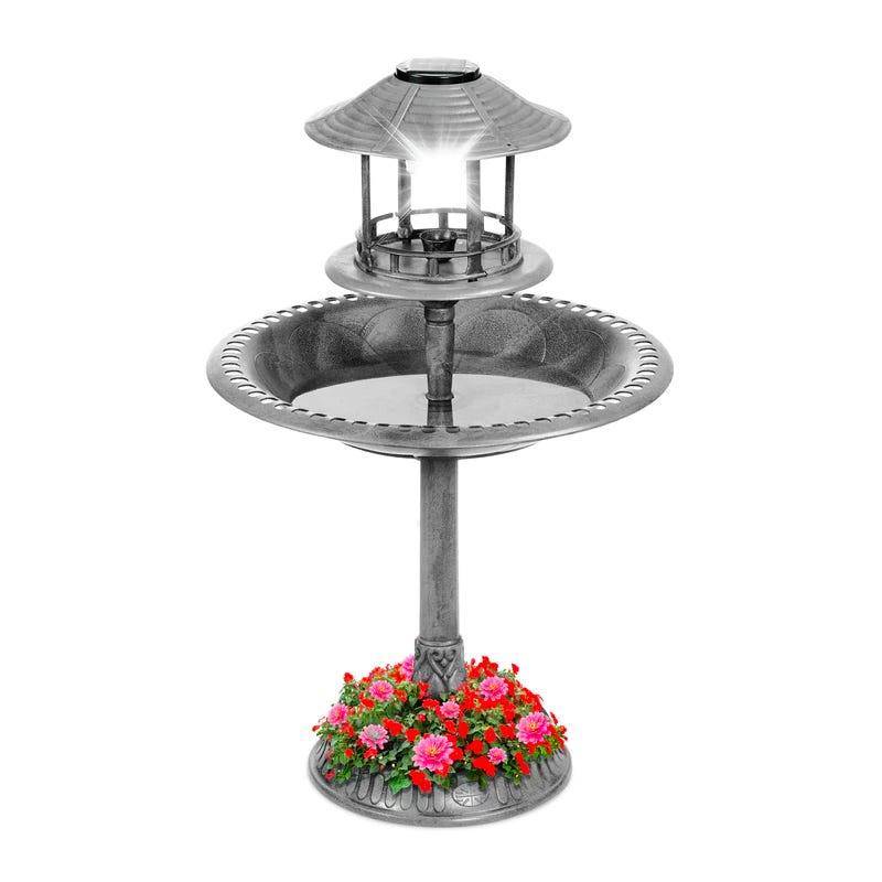 Solar-powered bird bath fountain with integrated planter base.