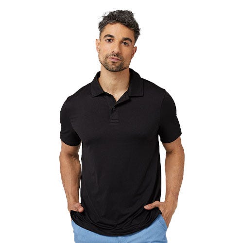 A man is wearing a black polo shirt paired with light blue pants.