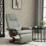 A gray recliner chair and a set of two black nested side tables.