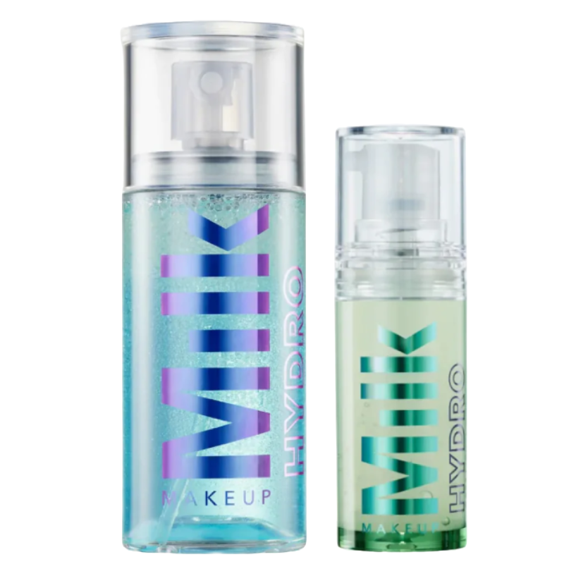 Two spray bottles from Milk Makeup, labeled \“Hydro,\“ featuring a blue and a green liquid.