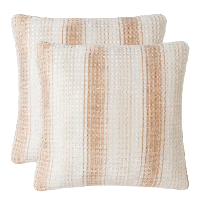 Two textured throw pillows with a waffle weave pattern and beige stripes.