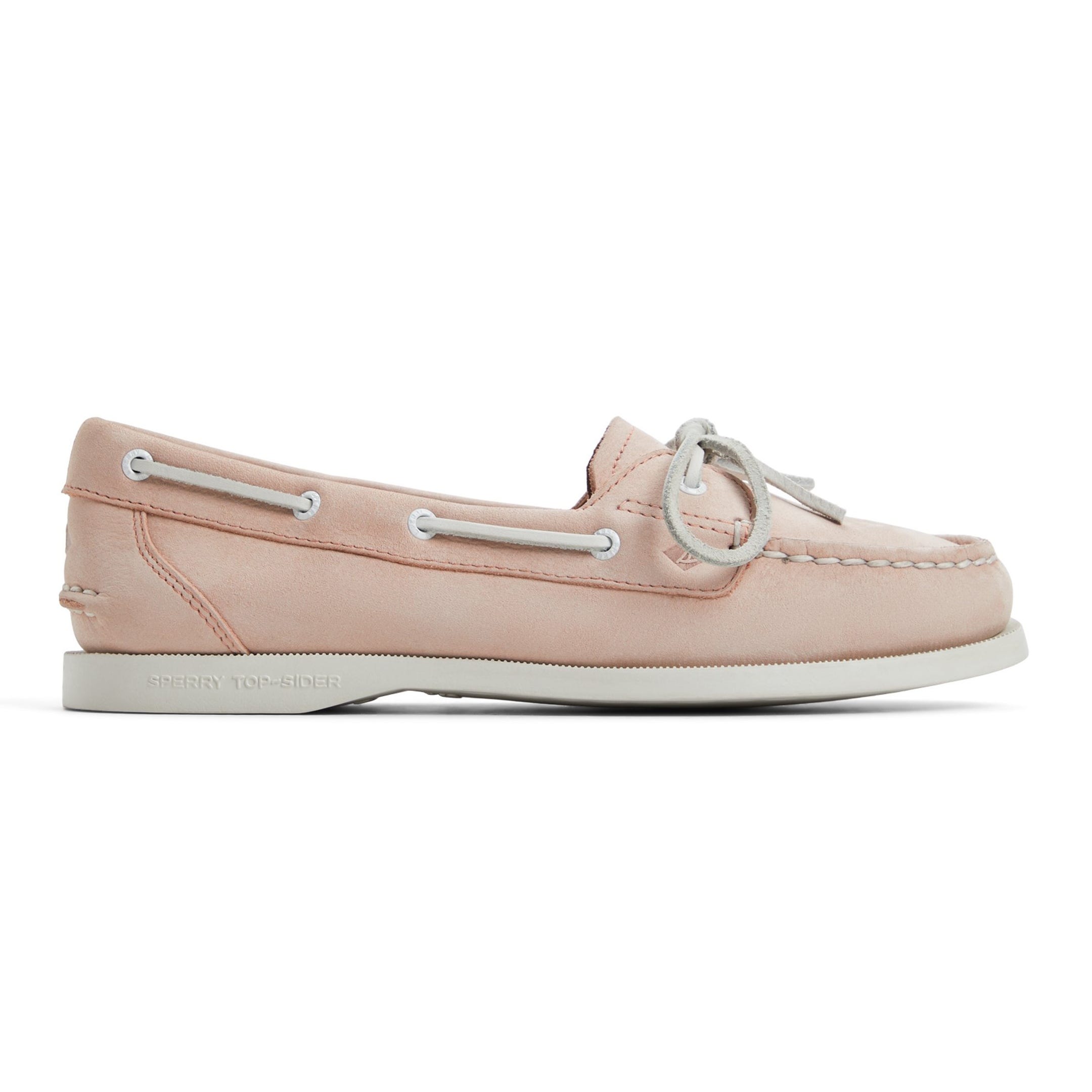 Light pink boat shoe with white laces and trim, featuring \“SPERRY TOP-SIDER\“ embossed on the side of the sole.